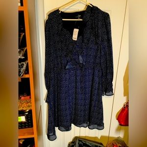 Light airy summer weight blur polka dot dress. Ruffled collar, front, and cuffs